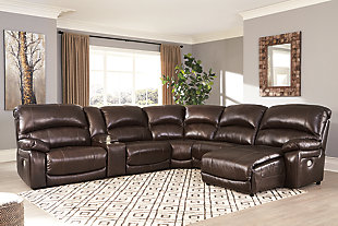 The Hallstrung reclining sectional makes you happy to be at home. Supple leather on the seating area with two-tone color is as comfortable as it is attractive. Faux leather upholstery on the sides and back is easy on the eyes and the wallet. High back design provides the support you need. Keep beverages nearby in the stainless steel cup holders. From the Easy View™ power headrest to the footrests, you're in control of your relaxation. Just plug in your device to the USB charging station and sit back, relax and enjoy your space.Includes 6 pieces: left-arm facing zero wall power recliner, right-arm facing press back power chaise, armless recliner, armless chair, console and wedge | "Left-arm" and "right-arm" describe the position of the arm when you face the piece | Zero wall design requires minimal space between wall and chair back | One-touch power control with adjustable positions | Easy View™ power adjustable headrest | Console with storage and 2 cup holders | USB charging station | Corner-blocked frame with metal reinforced seats | Attached back and seat cushions | High-resiliency foam cushions wrapped in thick poly fiber | Leather interior upholstery; vinyl/polyester exterior upholstery | Power cord included; UL Listed | Extended ottoman for enhanced comfort | Estimated Assembly Time: 55 Minutes