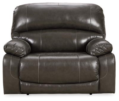 Fashion-forward style. Sumptuous leather feel and appeal. Total comfort at your fingertips. It’s all yours for the taking with the Hallstrung power recliner with adjustable headrest. Wrapped in an attractive gray upholstery, this decidedly contemporary power recliner tantalizes the senses in so many ways. Rest assured, the wide seating area is covered in 100% leather for your pleasure, while a skillfully matched faux leather on the exterior makes luxury affordable. Upping the comfort with 44" high back styling, this power recliner truly caters from head to toe. An Easy View™ power adjustable headrest allows you to lean back while propping up your head—perfect for chilling out in front of the TV—while an extended ottoman lets you stretch out all the more. And with a USB port in the power control panel, you hardly have to move a muscle to stay powered up.High-resiliency foam cushions wrapped in thick poly fiber | Corner-blocked frame with metal reinforced seat | One-touch power control with adjustable positions | 44" high back design | Attached back and seat cushions | Easy View™ power adjustable headrest | Leather interior upholstery; polyester/vinyl exterior upholstery | Extended ottoman for enhanced comfort | Includes USB charging port in the power control | Power cord included; UL Listed | Estimated Assembly Time: 15 Minutes