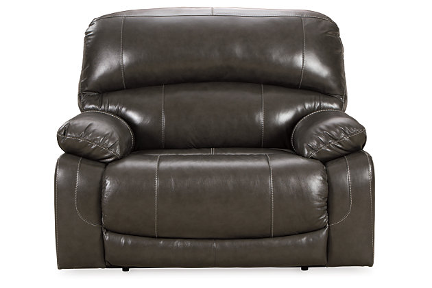 Fashion-forward style. Sumptuous leather feel and appeal. Total comfort at your fingertips. It’s all yours for the taking with the Hallstrung power recliner with adjustable headrest. Wrapped in an attractive gray upholstery, this decidedly contemporary power recliner tantalizes the senses in so many ways. Rest assured, the wide seating area is covered in 100% leather for your pleasure, while a skillfully matched faux leather on the exterior makes luxury affordable. Upping the comfort with 44" high back styling, this power recliner truly caters from head to toe. An Easy View™ power adjustable headrest allows you to lean back while propping up your head—perfect for chilling out in front of the TV—while an extended ottoman lets you stretch out all the more. And with a USB port in the power control panel, you hardly have to move a muscle to stay powered up.High-resiliency foam cushions wrapped in thick poly fiber | Corner-blocked frame with metal reinforced seat | One-touch power control with adjustable positions | 44" high back design | Attached back and seat cushions | Easy View™ power adjustable headrest | Leather interior upholstery; polyester/vinyl exterior upholstery | Extended ottoman for enhanced comfort | Includes USB charging port in the power control | Power cord included; UL Listed | Estimated Assembly Time: 15 Minutes