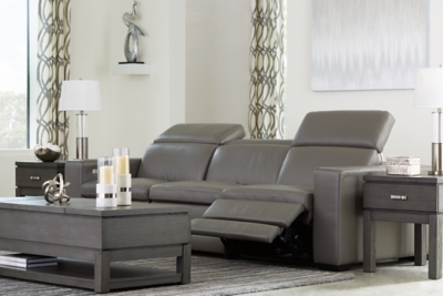 Truly putting high design into recline, the Texline sofa with genuine leather seating area proves that just because you’re a recliner doesn’t mean you have to look like one. Deceptively beautiful, its ultra clean-lined aesthetic is as cool and contemporary as they come. Low-profile back has a super swank look. When you need more support for your head and neck, the press of a button engages the Easy View™ power adjustable headrest, designed to let you lean back and still have a primo view of the TV. The zero wall design requires minimal space between wall and chair back, and indulgent pillow top seating gives an added layer of comfort.Includes 4 pieces: right-arm facing armless power recliner, left-arm facing armless power recliner and armless chair and left-arm/right-arm facing power arm | One-touch power control with adjustable positions, Easy View™ adjustable headrest and zero-draw USB plug-in | Zero-draw technology only consumes power when the USB receptacle is in use | Corner-blocked frame with metal reinforced seat | Attached back and seat cushions | Pillow top seats | High-resiliency foam cushions wrapped in thick poly fiber | Zero wall design requires minimal space between wall and chair back | Extended ottoman for enhanced comfort | Leather interior upholstery; vinyl/polyester exterior upholstery | Power cord included; UL Listed | Exposed feet with faux wood finish | Estimated Assembly Time: 60 Minutes