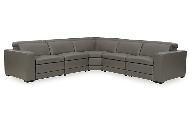 Truly putting high design into recline, the Texline sectional with genuine leather seating area proves that just because you’re a recliner doesn’t mean you have to look like one. Deceptively beautiful, its ultra clean-lined aesthetic is as cool and contemporary as they come. Low-profile back has a super swank look. When you need more support for your head and neck, the press of a button engages the Easy View™ power adjustable headrest, designed to let you lean back and still have a primo view of the TV. The zero wall design requires minimal space between wall and chair back, and indulgent pillow top seating gives an added layer of comfort.Includes 6 pieces: right-arm facing armless power recliner, left-arm facing armless power recliner, left-arm/right-arm facing power arm, 2 armless chairs and wedge | One-touch power control with adjustable positions, Easy View™ adjustable headrest and zero-draw USB plug-in | Zero-draw technology only consumes power when the USB receptacle is in use | Corner-blocked frame with metal reinforced seat | Attached back and seat cushions | Pillow top seats | High-resiliency foam cushions wrapped in thick poly fiber | Zero wall design requires minimal space between wall and chair back | Extended ottoman for enhanced comfort | Leather interior upholstery; vinyl/polyester exterior upholstery | Power cord included; UL Listed | Exposed feet with faux wood finish | Estimated Assembly Time: 80 Minutes