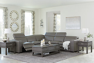 Truly putting high design into recline, the Texline sectional with genuine leather seating area proves that just because you’re a recliner doesn’t mean you have to look like one. Deceptively beautiful, its ultra clean-lined aesthetic is as cool and contemporary as they come. Low-profile back has a super swank look. When you need more support for your head and neck, the press of a button engages the Easy View™ power adjustable headrest, designed to let you lean back and still have a primo view of the TV. The zero wall design requires minimal space between wall and chair back, and indulgent pillow top seating gives an added layer of comfort.Includes 6 pieces: right-arm facing armless power recliner, left-arm facing armless power recliner, left-arm/right-arm facing power arm, 2 armless chairs and wedge | One-touch power control with adjustable positions, Easy View™ adjustable headrest and zero-draw USB plug-in | Zero-draw technology only consumes power when the USB receptacle is in use | Corner-blocked frame with metal reinforced seat | Attached back and seat cushions | Pillow top seats | High-resiliency foam cushions wrapped in thick poly fiber | Zero wall design requires minimal space between wall and chair back | Extended ottoman for enhanced comfort | Leather interior upholstery; vinyl/polyester exterior upholstery | Power cord included; UL Listed | Exposed feet with faux wood finish | Estimated Assembly Time: 80 Minutes