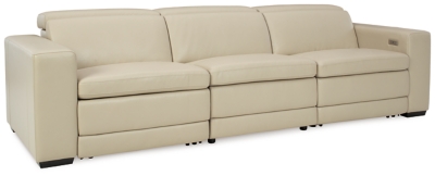 Truly putting high design into recline, the Texline sofa with genuine leather seating area proves that just because you’re a recliner doesn’t mean you have to look like one. Deceptively beautiful, its ultra clean-lined aesthetic is as cool and contemporary as they come. Low-profile back has a super swank look. When you need more support for your head and neck, the press of a button engages the Easy View™ power adjustable headrest, designed to let you lean back and still have a primo view of the TV. The zero wall design requires minimal space between wall and chair back, and indulgent pillow top seating gives an added layer of comfort.Includes 4 pieces: right-arm facing armless power recliner, left-arm facing armless power recliner, left-arm/right-arm facing power arm and armless chair | One-touch power control with adjustable positions, Easy View™ adjustable headrest and zero-draw USB plug-in | Zero-draw technology only consumes power when the USB receptacle is in use | Corner-blocked frame with metal reinforced seat | Attached back and seat cushions | Pillow top seats | High-resiliency foam cushions wrapped in thick poly fiber | Zero wall design requires minimal space between wall and chair back | Extended ottoman for enhanced comfort | Leather interior upholstery; vinyl/polyester exterior upholstery | Power cord included; UL Listed | Exposed feet with faux wood finish | Estimated Assembly Time: 75 Minutes