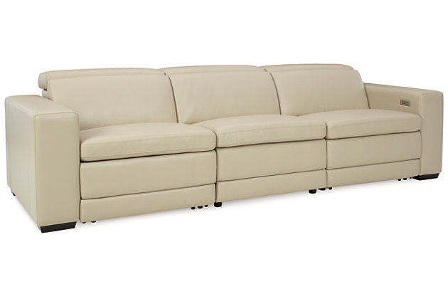 Truly putting high design into recline, the Texline sofa with genuine leather seating area proves that just because you’re a recliner doesn’t mean you have to look like one. Deceptively beautiful, its ultra clean-lined aesthetic is as cool and contemporary as they come. Low-profile back has a super swank look. When you need more support for your head and neck, the press of a button engages the Easy View™ power adjustable headrest, designed to let you lean back and still have a primo view of the TV. The zero wall design requires minimal space between wall and chair back, and indulgent pillow top seating gives an added layer of comfort.Includes 4 pieces: right-arm facing armless power recliner, left-arm facing armless power recliner, left-arm/right-arm facing power arm and armless chair | One-touch power control with adjustable positions, Easy View™ adjustable headrest and zero-draw USB plug-in | Zero-draw technology only consumes power when the USB receptacle is in use | Corner-blocked frame with metal reinforced seat | Attached back and seat cushions | Pillow top seats | High-resiliency foam cushions wrapped in thick poly fiber | Zero wall design requires minimal space between wall and chair back | Extended ottoman for enhanced comfort | Leather interior upholstery; vinyl/polyester exterior upholstery | Power cord included; UL Listed | Exposed feet with faux wood finish | Estimated Assembly Time: 75 Minutes