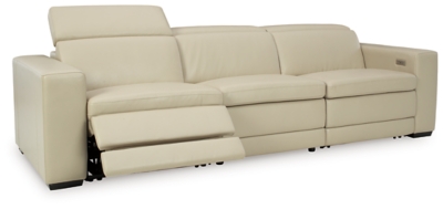 Truly putting high design into recline, the Texline sofa with genuine leather seating area proves that just because you’re a recliner doesn’t mean you have to look like one. Deceptively beautiful, its ultra clean-lined aesthetic is as cool and contemporary as they come. Low-profile back has a super swank look. When you need more support for your head and neck, the press of a button engages the Easy View™ power adjustable headrest, designed to let you lean back and still have a primo view of the TV. The zero wall design requires minimal space between wall and chair back, and indulgent pillow top seating gives an added layer of comfort.Includes 4 pieces: right-arm facing armless power recliner, left-arm facing armless power recliner, left-arm/right-arm facing power arm and armless chair | One-touch power control with adjustable positions, Easy View™ adjustable headrest and zero-draw USB plug-in | Zero-draw technology only consumes power when the USB receptacle is in use | Corner-blocked frame with metal reinforced seat | Attached back and seat cushions | Pillow top seats | High-resiliency foam cushions wrapped in thick poly fiber | Zero wall design requires minimal space between wall and chair back | Extended ottoman for enhanced comfort | Leather interior upholstery; vinyl/polyester exterior upholstery | Power cord included; UL Listed | Exposed feet with faux wood finish | Estimated Assembly Time: 75 Minutes