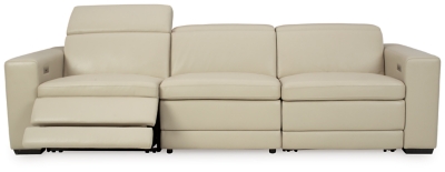 Truly putting high design into recline, the Texline sofa with genuine leather seating area proves that just because you’re a recliner doesn’t mean you have to look like one. Deceptively beautiful, its ultra clean-lined aesthetic is as cool and contemporary as they come. Low-profile back has a super swank look. When you need more support for your head and neck, the press of a button engages the Easy View™ power adjustable headrest, designed to let you lean back and still have a primo view of the TV. The zero wall design requires minimal space between wall and chair back, and indulgent pillow top seating gives an added layer of comfort.Includes 4 pieces: right-arm facing armless power recliner, left-arm facing armless power recliner, left-arm/right-arm facing power arm and armless chair | One-touch power control with adjustable positions, Easy View™ adjustable headrest and zero-draw USB plug-in | Zero-draw technology only consumes power when the USB receptacle is in use | Corner-blocked frame with metal reinforced seat | Attached back and seat cushions | Pillow top seats | High-resiliency foam cushions wrapped in thick poly fiber | Zero wall design requires minimal space between wall and chair back | Extended ottoman for enhanced comfort | Leather interior upholstery; vinyl/polyester exterior upholstery | Power cord included; UL Listed | Exposed feet with faux wood finish | Estimated Assembly Time: 75 Minutes