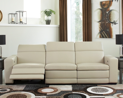 Truly putting high design into recline, the Texline sofa with genuine leather seating area proves that just because you’re a recliner doesn’t mean you have to look like one. Deceptively beautiful, its ultra clean-lined aesthetic is as cool and contemporary as they come. Low-profile back has a super swank look. When you need more support for your head and neck, the press of a button engages the Easy View™ power adjustable headrest, designed to let you lean back and still have a primo view of the TV. The zero wall design requires minimal space between wall and chair back, and indulgent pillow top seating gives an added layer of comfort.Includes 4 pieces: right-arm facing armless power recliner, left-arm facing armless power recliner, left-arm/right-arm facing power arm and armless chair | One-touch power control with adjustable positions, Easy View™ adjustable headrest and zero-draw USB plug-in | Zero-draw technology only consumes power when the USB receptacle is in use | Corner-blocked frame with metal reinforced seat | Attached back and seat cushions | Pillow top seats | High-resiliency foam cushions wrapped in thick poly fiber | Zero wall design requires minimal space between wall and chair back | Extended ottoman for enhanced comfort | Leather interior upholstery; vinyl/polyester exterior upholstery | Power cord included; UL Listed | Exposed feet with faux wood finish | Estimated Assembly Time: 75 Minutes