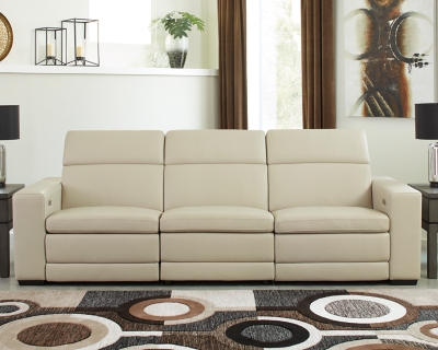 Truly putting high design into recline, the Texline sofa with genuine leather seating area proves that just because you’re a recliner doesn’t mean you have to look like one. Deceptively beautiful, its ultra clean-lined aesthetic is as cool and contemporary as they come. Low-profile back has a super swank look. When you need more support for your head and neck, the press of a button engages the Easy View™ power adjustable headrest, designed to let you lean back and still have a primo view of the TV. The zero wall design requires minimal space between wall and chair back, and indulgent pillow top seating gives an added layer of comfort.Includes 4 pieces: right-arm facing armless power recliner, left-arm facing armless power recliner, left-arm/right-arm facing power arm and armless chair | One-touch power control with adjustable positions, Easy View™ adjustable headrest and zero-draw USB plug-in | Zero-draw technology only consumes power when the USB receptacle is in use | Corner-blocked frame with metal reinforced seat | Attached back and seat cushions | Pillow top seats | High-resiliency foam cushions wrapped in thick poly fiber | Zero wall design requires minimal space between wall and chair back | Extended ottoman for enhanced comfort | Leather interior upholstery; vinyl/polyester exterior upholstery | Power cord included; UL Listed | Exposed feet with faux wood finish | Estimated Assembly Time: 75 Minutes