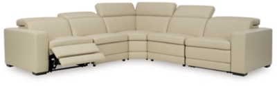 Truly putting high design into recline, the Texline sectional with genuine leather seating area proves that just because you’re a recliner doesn’t mean you have to look like one. Deceptively beautiful, its ultra clean-lined aesthetic is as cool and contemporary as they come. Low-profile back has a super swank look. When you need more support for your head and neck, the press of a button engages the Easy View™ power adjustable headrest, designed to let you lean back and still have a primo view of the TV.Includes 6 pieces: right-arm facing armless power recliner, left-arm facing armless power recliner, left-arm/right-arm facing power arm, 2 armless chairs and wedge | One-touch power control with adjustable positions, Easy View™ adjustable headrest and zero-draw USB plug-in | Zero-draw technology only consumes power when the USB receptacle is in use | Corner-blocked frame with metal reinforced seat | Attached back and seat cushions | Pillow top seats | High-resiliency foam cushions wrapped in thick poly fiber | Extended ottoman for enhanced comfort | Leather interior upholstery; vinyl/polyester exterior upholstery    | Power cord included; UL Listed | Exposed feet with faux wood finish | Zero wall design requires minimal space between wall and chair back | Estimated Assembly Time: 110 Minutes