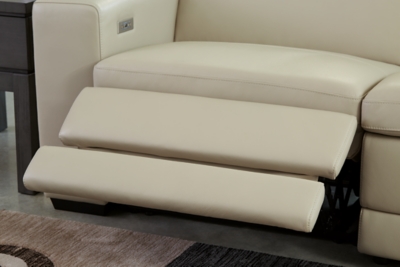 Truly putting high design into recline, the Texline sofa with genuine leather seating area proves that just because you’re a recliner doesn’t mean you have to look like one. Deceptively beautiful, its ultra clean-lined aesthetic is as cool and contemporary as they come. Low-profile back has a super swank look. When you need more support for your head and neck, the press of a button engages the Easy View™ power adjustable headrest, designed to let you lean back and still have a primo view of the TV. The zero wall design requires minimal space between wall and chair back, and indulgent pillow top seating gives an added layer of comfort.Includes 4 pieces: right-arm facing armless power recliner, left-arm facing armless power recliner, left-arm/right-arm facing power arm and armless chair | One-touch power control with adjustable positions, Easy View™ adjustable headrest and zero-draw USB plug-in | Zero-draw technology only consumes power when the USB receptacle is in use | Corner-blocked frame with metal reinforced seat | Attached back and seat cushions | Pillow top seats | High-resiliency foam cushions wrapped in thick poly fiber | Zero wall design requires minimal space between wall and chair back | Extended ottoman for enhanced comfort | Leather interior upholstery; vinyl/polyester exterior upholstery | Power cord included; UL Listed | Exposed feet with faux wood finish | Estimated Assembly Time: 75 Minutes