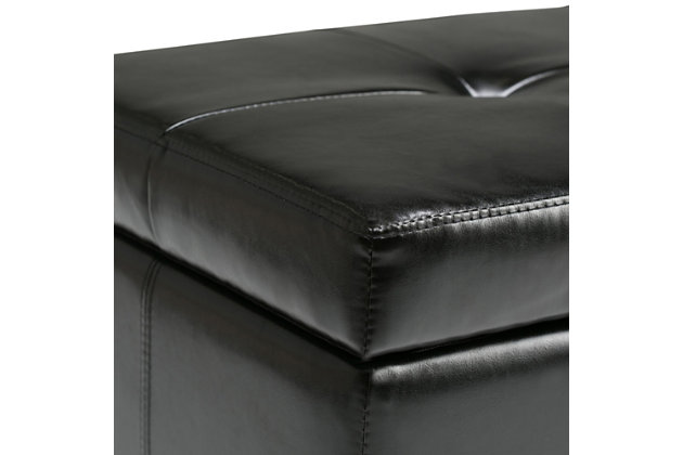 Why sacrifice function for beauty. When you are looking for a tasteful, well-made storage solution and extra seating, look no further than this storage ottoman. Made from durable bonded leather, it’s extra strong and sturdy with a stitched exterior and a large storage interior. Whether you are using it as an eating surface, a storage unit or just to put your feet up, this ottoman is a pretty and practical piece of furniture.DIMENSIONS: 48"W x 17.7"D x 16.1"H | Hand constructed using solid wood, engineered wood and high density foam | Upholstered with a durable Midnight Black Faux Leather | Features large interior storage space with child safety hinge to prevent lid slamming | Multi-functional ottoman can be used in bedroom, living room, family room, hallway as an entryway bench, foot stool, accent furniture or provide additional sitting | Contemporary design includes tufting on the lid and stitching detail | Simple assembly; just attach legs | We believe in creating excellent, high quality products made from the finest materials at an affordable price. Every one of our products come with a 1-year warranty and easy returns if you are not satisfied.
