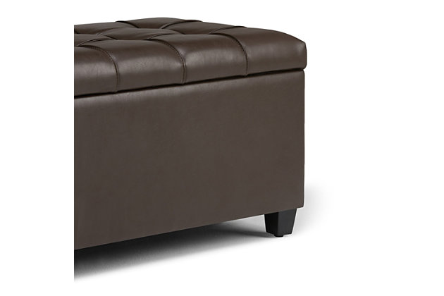 Why sacrifice function for beauty. When you are looking for a tasteful, well-made storage solution and extra seating, look no further than this storage ottoman. Made from durable faux leather, it’s extra strong and sturdy with a button-tufted exterior and a large storage interior. Whether you are using it as an eating surface, a storage unit or just to put your feet up, this ottoman is a pretty and practical piece of furniture.DIMENSIONS: 33.5” W x 18” D x 16.5”H | Hand constructed using solid wood, engineered wood and high density foam | Upholstered with a durable Chocolate Brown Faux Leather | Features large interior storage space with child safety hinge to prevent lid slamming | Multi-functional ottoman can be used in bedroom, living room, family room, hallway as an entryway bench, foot stool, accent furniture or provide additional sitting | Transitional design includes tufted stitched detailing | Simple assembly; just attach legs | We believe in creating excellent, high quality products made from the finest materials at an affordable price. Every one of our products come with a 1-year warranty and easy returns if you are not satisfied.