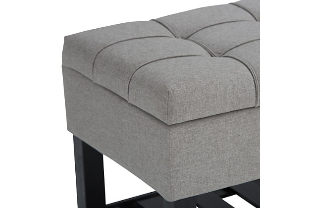 Why sacrifice function for beauty. When you are looking for a tasteful, well-made storage solution and extra seating, look no further than this storage ottoman. Made from durable faux linen upholstery, it’s extra strong and sturdy with a stitched and tufted exterior, a large storage interior and a bottom storage area. Whether you are using it in your entryway, living room or bedroom, this ottoman is a pretty and practical piece of furniture.DIMENSIONS: 43.5"W x 17"D x 18.5"H | Hand constructed using solid wood, plywood, foam | Upholstered with a durable Dove Grey Linen Look Fabric | Features lift up lid with child safety hinge to prevent lid slamming, large interior storage and open slat bottom shelf | Multi-functional ottoman can be used in bedroom, living room, family room, hallway as an entryway bench or provide additional sitting | Transitional design includes tufted and top stitching detail | Assembly required | We believe in creating excellent, high quality products made from the finest materials at an affordable price. Every one of our products come with a 1-year warranty and easy returns if you are not satisfied.