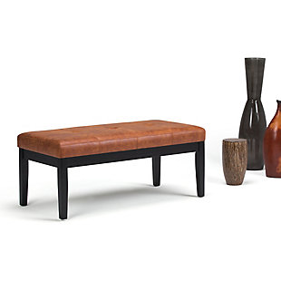 Why sacrifice function for beauty. When you are looking for extra seating, look no further than this ottoman bench. Covered in faux leather upholstery, it’s extra strong and sturdy with a cushioned seat and dark finished legs. Whether you are using it in your entryway, living room or bedroom, this bench is a pretty and practical piece of furniture.Made of wood and engineered wood | Faux leather upholstery | Dark finished frame and legs | Assembly required