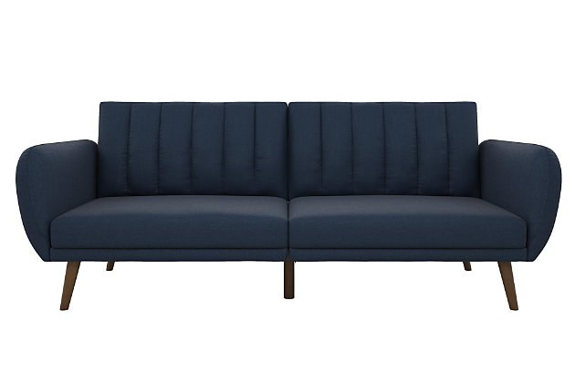 Be embraced by the comfortable cushioning of the Novogratz Brittany linen futon. With its ribbed tufted cushioned back, the Novogratz Brittany Linen futon gives your body all the support you need to sit and relax for hours. The combination of curved armrests and slanted legs work together to provide a unique rounded look that stands out. The linen upholstery adds another element of elegance making this a perfect statement piece for any living space.Stylish linen upholstery wipes clean easily | Ribbed tufted cushioned back | Sturdy wood frame construction | Slanted oak coloured wooden legs