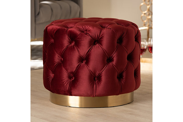 This modern and glamourous ottoman has luxury written all over it. From the plush cushion padded with foam and upholstered in a rich, soft to the touch velvet fabric, to the brushed goldtone finish on the base. The all-over button tufting highlights the subtle sheen of the velvet creating a decadently cool and comfortable appeal as a footstool or extra seating in your home.Engineered wood and stainless-steel frame | Burgundy polyester velvet upholstery | Button tufted | Brushed goldtone metal base | No assembly required