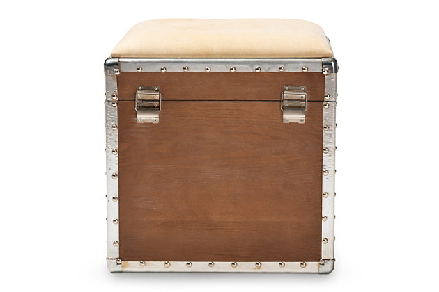 Featuring a striking mix of textures, this ottoman adds character to any space. Cool rivet detailing and an upholstered seat that can be flipped up to reveal an inner storage compartment add a level of interest and abundant practicality. Modeled after vintage storage trunks and accented with silver metal handles, an imitation lock and an antique-inspired inscription, this is sure to be a conversation piece in any room of your home.Made of engineered wood | Light brown finish | Silvertone accents | Beige polyester upholstered seat cushion | Weight capacity 100 pounds | No assembly required