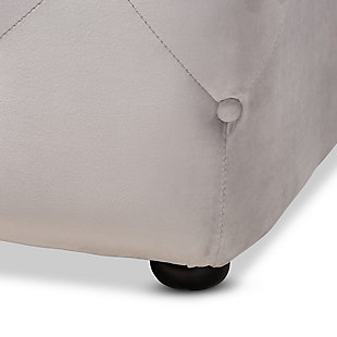 Raise your standard of living with this ottoman upholstered in a soft, sumptuous velvet fabric. Reserved exclusively for those with a penchant for high-glam home decor, this ultra-chic ottoman is dressed to impress with all over button tufting that simply works. Easy-on-the-eyes and alluring to the touch, this decidedly elegant and versatile ottoman can be used as a coffee table, footstool or as extra seating for guests.Eucalyptus wood frame | Slate gray polyester velvet upholstery with button tufting | Black finished feet | No assembly required