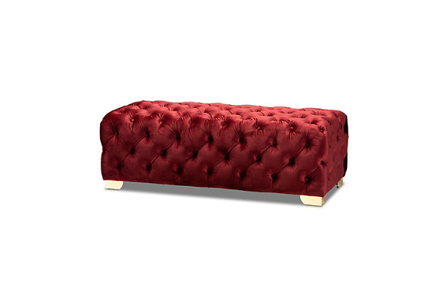 Raise your standard of living with this ottoman bench upholstered in a soft, sumptuous velvet fabric. Reserved exclusively for those with a penchant for high-glam home decor, this ultra-chic bench is dressed to impress with all-over button tufting and lustrous goldtone finished metal feet that simply work. Easy on the eyes and alluring to the touch, this decidedly elegant and versatile bench can be placed anywhere from the entryway to the foot of the bed.Engineered wood frame | Metal feet | Burgundy velvet upholstery | No assembly required