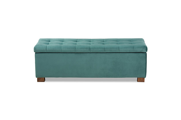 Perfect as a bed end bench for your bedroom or as an accent piece in your living space, the Roanoke storage bench combines handy seating and storage in a stylish way. Constructed with rubberwood, the bench features a cushioned seat upholstered in a soft teal velvet fabric that adds a dose of glamour to your space. The elegant grid-tufted top opens to reveal ample storage space, while walnut brown legs create a strong foundation.Contemporary style | Walnut brown legs | Made of rubberwood, engineered wood, polyester and foam | Upholstered in teal velvet polyester fabric; foam padding | Lift-top storage compartment | Imported | Requires leg assembly
