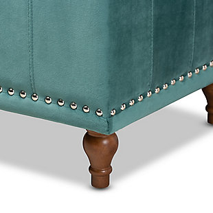 Whether it's placed in the bedroom or living room, the versatile Kaylee bench offers elegant style and handy storage space. Constructed with rubberwood, this storage bench is upholstered in a soft teal velvet fabric that adds a dose of glamour to your space. The top is padded with foam for seating comfort, and opens to reveal ample storage space for extra blankets and linens. Silver nailhead trim and grid stitching lend a modern look, while button tufting and turned feet add a refined elegance.Contemporary style | Walnut brown legs | Made of rubberwood, engineered wood, polyester and foam | Upholstered in teal velvet polyester fabric; foam padding | Lift-top storage compartment | Imported | Requires leg assembly