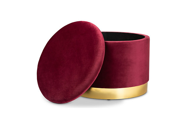 Maximize your storage capacity in the most glamorous way with the glam Marisa ottoman. Padded with foam for the utmost comfort, it features a removable lid that reveals ample storage space. Sleek red velvet fabric upholstery feels exceptionally soft to the touch and complements the striking goldtone finish on the base. This chic piece is well suited for use as a footstool or extra seating.Contemporary style | Goldtone base | Made of engineered wood, metal, polyester and foam | Upholstered in a red velvet polyester fabric; foam padding | Imported | Arrives fully assembled