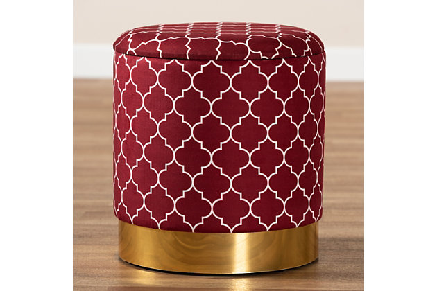 Maximize your storage capacity in the most glamorous way with the mid-century modern Serra ottoman. Padded with foam for the utmost comfort, it features a removable lid that reveals ample storage space. The sleek velvet upholstery displays a quatrefoil pattern for a bold, eye-catching look that complements the striking goldtone base. This chic piece is well suited for use as a footstool or extra seating.Contemporary style | Made of wood, engineered wood, metal, polyester and foam | Upholstered in red velvet fabric; foam padding | Imported | Arrives fully assembled