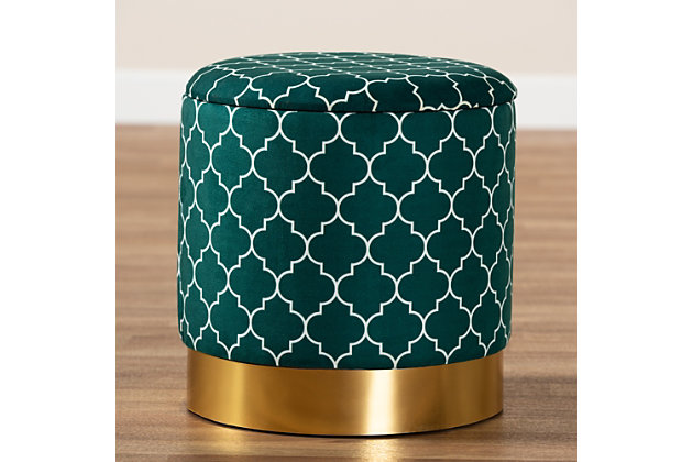 Maximize your storage capacity in the most glamorous way with the mid-century modern Serra ottoman. Padded with foam for the utmost comfort, it features a removable lid that reveals ample storage space. The sleek velvet upholstery displays a quatrefoil pattern for a bold, eye-catching look that complements the striking goldtone base. This chic piece is well suited for use as a footstool or extra seating.Contemporary style | Made of wood, engineered wood, metal, polyester and foam | Upholstered in green velvet fabric; foam padding | Imported | Arrives fully assembled