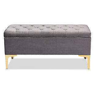 Glamorous seating doubles as practical storage in the Valere ottoman. Constructed from oak wood, the Valere is upholstered in a lavish gray velvet fabric and padded with foam for the utmost sitting comfort. The elegant button-tufted top opens to reveal ample storage space, while goldtone legs add a striking look. The Valere is well suited for use as a bench in a bedroom, or as an accent piece in the living room.Contemporary style | Made of oak wood, polyester and foam | Goldtone legs | Upholstered in gray velvet polyester fabric; foam padding | Lift-up storage compartment | Imported | Assembly required
