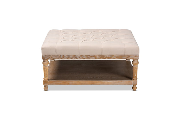 Add a touch of sophisticated grace to your home with the modern-style Kelly cocktail ottoman. The ottoman is fitted with a wood storage shelf to hold books, movies and more. Padded with foam for the utmost comfort, it's upholstered in linen fabric and enhanced with elegant button tufting. Excellent craftsmanship adds a weathered feel to the ottoman, giving it a hint of rustic charm.Contemporary style | Beige linen upholstery; foam padding | Lower storage shelf made of wood and engineered wood; gray wash finish | Imported | Assembly required