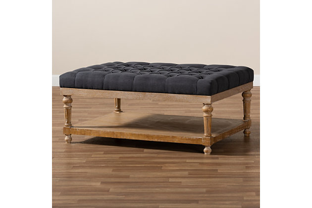 Add a touch of sophisticated grace to your home with the Lindsey ottoman. This modern ottoman is fitted with a wood storage shelf to hold books, movies and more. Padded with foam for the utmost comfort, this ottoman is upholstered in linen fabric and enhanced with elegant button tufting. Excellent craftsmanship adds a weathered feel to the piece, giving it a hint of rustic charm. A perfect accent in rooms with open space, this ottoman can spruce up any modern living room with its stylish utility.Contemporary style | Charcoal-colored linen upholstery; foam padding | Lower storage shelf made of wood and engineered wood; gray wash finish | Imported | Assembly required