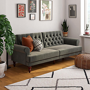 Vintage in design, the Novogratz Upholstered Cassidy Futon has the perfect touch of modern style to give your living room the wow factor it deserves. Upholstered in soft velvet, the versatile Cassidy Futon has plush rolled arms and button-tufted details on the back cushions. One of the best features is the multiple trendy colors in which it is offered which gives you the choice of adding a pop of color or opt for a more neutral tone. The Cassidy has a strong wood frame that sits on solid rubber wood legs with scrollwork details. What’s more, its multi-functional design offers the possibility to independently recline the backrest between sitting, lounging and sleeping to fit with the situation. Whether you want to read a good book, lounge back to watch a movie or lay down for a nap, the Novogratz Cassidy Futon has your back! Available in multiple color options. Ideal for your living room, guest bedroom or home office.Vintage design with plush rolled arms and button-tufted details on the back cushions. | Strong wood frame upholstered with a soft velvet upholstery that sits on solid rubber wood legs. | Multi-functional design. Backrest reclines independently between sitting, lounging and sleeping.