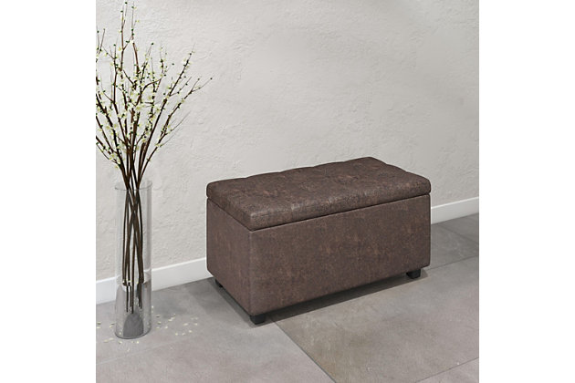 Why sacrifice function for beauty. For a stylish solution to your storage needs, look no further than the Cosmopolitan Rectangular Storage Ottoman. The unit is made from durable fabrics and is extra strong and durable featuring a beautiful tufted exterior and storage interior. Whether you use this ottoman in your entryway, living room, family room, basement or bedroom, it will allow you to hide away all that mess.; Efforts are made to reproduce accurate colors, variations in color may occur due to computer monitor and photography; At Simpli Home we believe in creating excellent, high quality products made from the finest materials at an affordable price. Every one of our products come with a 1-year warranty and easy returns if you are not satisfiedDIMENSIONS: 17.3" D x 33.5" W x 18.5" H | Hand constructed using solid wood, engineered wood and high density foam | Upholstered with a durable Distressed Black Faux Leather | Features interior storage space with child safety hinge to prevent lid slamming | Multi-functional ottoman can be used in bedroom, living room, family room, hallway as an entryway bench, foot stool, accent furniture or provide additional sitting | Transitional design includes tufted top and stitching detail | Simple assembly; just attach legs | We believe in creating excellent, high quality products made from the finest materials at an affordable price. Every one of our products come with a 1-year warranty and easy returns if you are not satisfied.