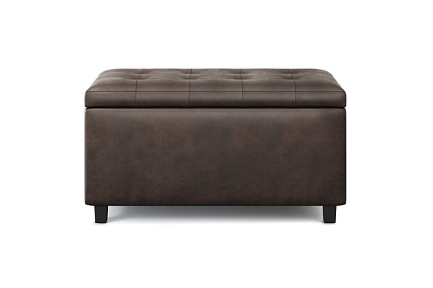 Why sacrifice function for beauty. For a stylish solution to your storage needs, look no further than the Cosmopolitan Rectangular Storage Ottoman. The unit is made from durable fabrics and is extra strong and durable featuring a beautiful tufted exterior and large storage interior. Whether you use this ottoman in your entryway, living room, family room, basement or bedroom, it will allow you to hide away all that mess.; Efforts are made to reproduce accurate colors, variations in color may occur due to computer monitor and photography; At Simpli Home we believe in creating excellent, high quality products made from the finest materials at an affordable price. Every one of our products come with a 1-year warranty and easy returns if you are not satisfiedDIMENSIONS:  17.3" D x 33.5" W x 18.5" H | Hand constructed using solid wood, engineered wood and high density foam | Upholstered with a durable Distressed Black Faux Leather | Features large interior storage space with child safety hinge to prevent lid slamming | Multi-functional ottoman can be used in bedroom, living room, family room, hallway as an entryway bench, foot stool, accent furniture or provide additional sitting | Transitional design includes tufted top and stitching detail | Simple assembly; just attach legs | We believe in creating excellent, high quality products made from the finest materials at an affordable price. Every one of our products come with a 1-year warranty and easy returns if you are not satisfied.