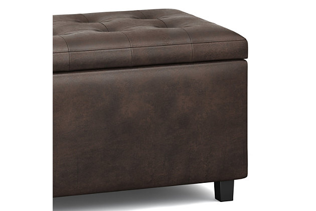Why sacrifice function for beauty. For a stylish solution to your storage needs, look no further than the Cosmopolitan Rectangular Storage Ottoman. The unit is made from durable fabrics and is extra strong and durable featuring a beautiful tufted exterior and large storage interior. Whether you use this ottoman in your entryway, living room, family room, basement or bedroom, it will allow you to hide away all that mess.; Efforts are made to reproduce accurate colors, variations in color may occur due to computer monitor and photography; At Simpli Home we believe in creating excellent, high quality products made from the finest materials at an affordable price. Every one of our products come with a 1-year warranty and easy returns if you are not satisfiedDIMENSIONS:  17.3" D x 33.5" W x 18.5" H | Hand constructed using solid wood, engineered wood and high density foam | Upholstered with a durable Distressed Black Faux Leather | Features large interior storage space with child safety hinge to prevent lid slamming | Multi-functional ottoman can be used in bedroom, living room, family room, hallway as an entryway bench, foot stool, accent furniture or provide additional sitting | Transitional design includes tufted top and stitching detail | Simple assembly; just attach legs | We believe in creating excellent, high quality products made from the finest materials at an affordable price. Every one of our products come with a 1-year warranty and easy returns if you are not satisfied.