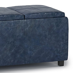 Why sacrifice function for beauty. For a stylish solution to your storage and serving needs, look no further than the Avalon Extra Large Rectangular Storage Ottoman. The unit is made from durable fabrics and comes with three flip over serving trays and lots of storage space. This attractive ottoman is extra strong and durable and features a beautiful stitched exterior and large storage interior. Whether you use this ottoman in your entryway, living room, family room, basement or bedroom, it will allow you to hide away all that mess and eat your food in comfort.; Efforts are made to reproduce accurate colors, variations in color may occur due to computer monitor and photography; At Simpli Home we believe in creating excellent, high quality products made from the finest materials at an affordable price. Every one of our products come with a 1-year warranty and easy returns if you are not satisfiedDIMENSIONS: 17" D x 42" W x 17" H; Hand constructed using solid wood, engineered wood and high density foam | Upholstered with a durable Denim Blue Faux Leather | Features 3 flip over serving trays and large interior storage; Assembly Required | Multi-functional ottoman can be used in bedroom, living room, family room, hallway as an entryway bench, foot stool, accent furniture or provide additional sitting; Contemporary design includes stitching detail