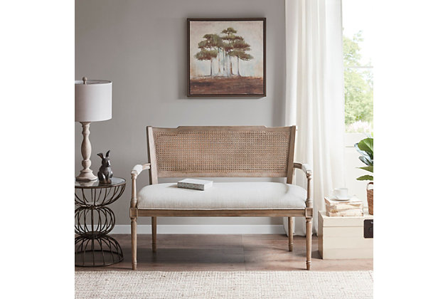 Give your living space some country charm with this beautifully designed settee. The rustic-style piece features pillow-topped arms and an attached cushion upholstered in beige fabric. A reclaimed natural wood finish and rattan insert on the back complement the upholstery, for a chic farmhouse look. Solid wood legs provide a strong and sturdy base. With a unique farmhouse aesthetic, this settee is the perfect choice for your living room, bedroom, entryway or den.Made with solid wood | Frame and legs with natural wood finish | Foam-filled fixed seat cushion with beige polyester upholstery | Pillow-topped arm with beige polyester upholstery | Rattan inset chair back | Weight capacity 600 pounds | No assembly required | Imported
