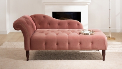 Pink chaise lounge on a rug