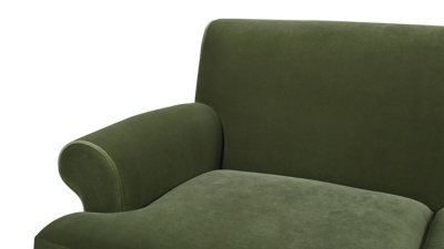 Close-up arm and cushion edge of olive green sofa
