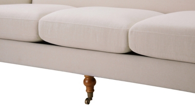 close-up of sofa base and caster wheel