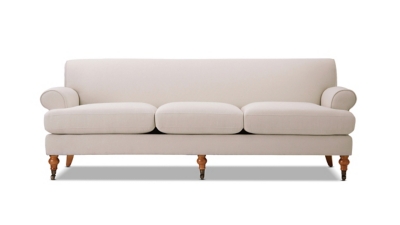 side view of beige sofa with three cushions