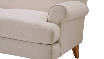 armrest close-up of beige sofa fabric and piping