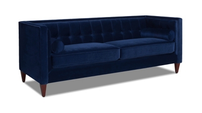Side/front angle view of navy blue sofa with tapered legs