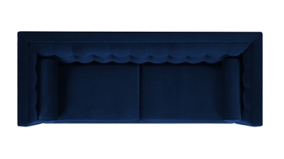 Top/overhead view of navy blue sofa showing tufted back