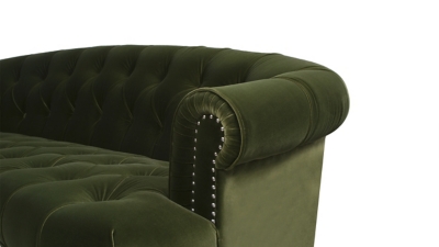 nailhead trim along bottom edge of green sofa