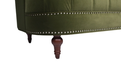 wood turned legs on green sofa