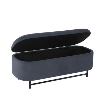 Blue upholstered storage bench with hinged lid opened, showing interior storage