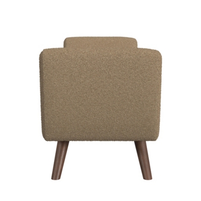 Front view of the beige upholstered armchair/sofa back showing its rounded back and wooden legs.