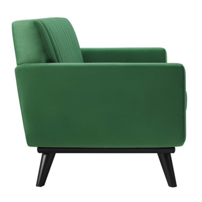 Side profile of emerald green sofa with visible leg