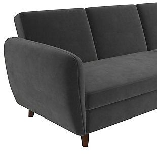 Resolving to keep your home neat and tidy for the upcoming year? Well, the Novogratz Perry Sectional Futon with Storage is exactly the classic multi-functional piece of furniture that you need to stay organized! Featuring slightly curved contouring along the armrests and upholstery in your choice of lush gray velvet or rich faux camel leather, the sofa exudes a thoroughly modern style and tone. Devised for compact living room or basement den areas, the chaise can be configured on either side of the futon and includes a large storage compartment to hide all of your stuff. Also, the adjustable backrest reclines to convert the couch into a comfortable and super convenient sleeper bed for visiting family or friends. Designed with longevity in mind, the Perry has been constructed with a durable wood frame that sits upon robust dark wood legs. Let the multi-purpose Perry re-define your space. Now that’s what we call a New Year’s solution!Soft curves and modern conventional style blend to create a sophisticated living room centerpiece. | Sectional futon with reclining backrest, interchangeable chaise and roomy storage compartment. Multi-functional piece turns into a sleeper bed to accommodate guests. Ideal for small spaces. | Crafted with robust wood frame and legs.  Offered in decadent camel faux leather or luxurious gray velvet upholstery.